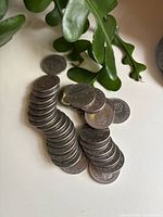 Stack of Canadian 1 dollar coins on table