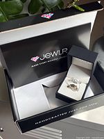 Jewlr branded outer box and ring box showing ring inside