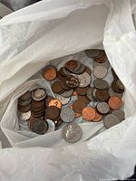 Bag containing mixed Canadian, US and UK coins