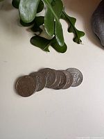 All six coins laid out