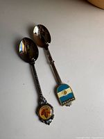 Both souvenir spoons full view