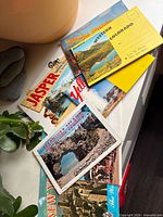 Group view of six vintage travel postcards and booklets