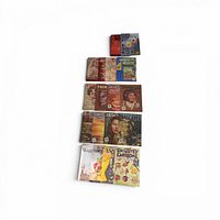 All twelve books arranged vertically, showing covers