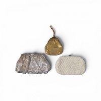 Group shot of three evening bags showing relative sizes and materials