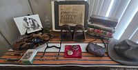 Overall view of memorabilia laid out on striped rug