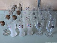 Front and angled view showing mix of branded beer glasses