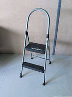 Front view of folded Cosco 2-step stool