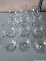 Top-down view showing all 12 clear glass snifters