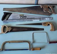 Overview showing six different hand saws laid out