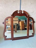 Front view of trifold vanity mirror closed