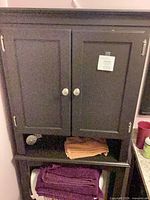 Front view of closed cabinet highlighting color, doors and hardware