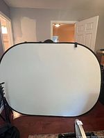 White side of collapsible background fully expanded