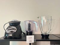 Base, processor bowl, glass pitcher displayed together
