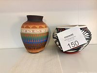 Both pottery pieces front view