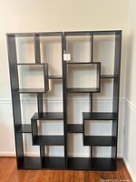 Front view of both black cube bookshelves side by side