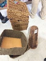 Stack of four medium baskets showing uniform weave and side handles