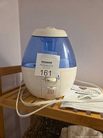 Front view of Vicks VUL520 humidifier showing power cord and control dial