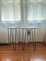 Front view of both side tables showing tops and legs