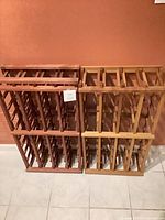 Front view of both wooden wine racks side by side