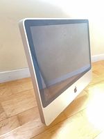 Front angled view of Apple 21.5-inch iMac showing screen and bezel