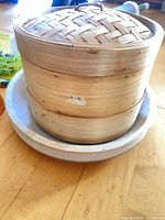 bamboo steamer stacked on plate visible