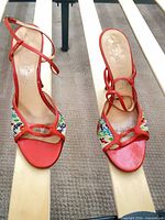 Top view of both sandals showing uppers, straps, toe opening, wear on insoles