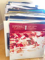 Stack of vinyl records showing Dopeskillz Alarmed EP at front