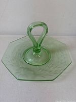 Top view showing octagonal shape, loop handle, etched pattern
