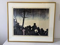 Straight-on view of framed woodcut showing full artwork, mat and frame