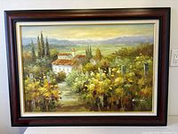 Full view of framed landscape painting