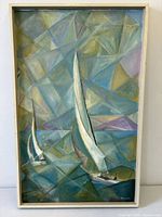 Frontal view of framed cubist sailboat painting