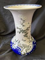Full view of vase showing shape, floral design and cobalt base