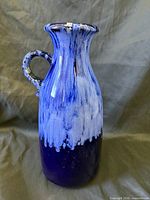 Full view of vase showing glaze pattern and handle