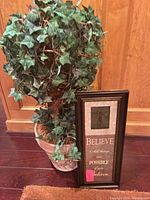 Topiary and framed plaque full view