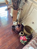 Overall lot showing vases, brass bowl, brass vase, ceramic pieces, tissue box and artificial roses