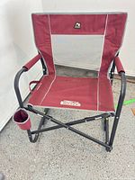 Full view of folded-out chair showing frame, fabric, cup holder