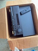 AV receiver with remote in shipping box
