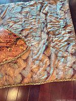 Comforter showing fern frond pattern side