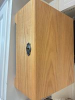 Closed light oak jewelry box showing exterior and finish