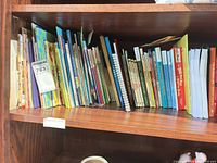 Full shelf view showing total quantity and assorted picture book spines