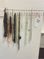 Overview of all necklaces hanging on rack