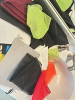 Assorted mesh, cotton and fabric drawstring bags spread on sink