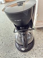 Front view showing full unit and carafe