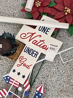 Cross sign, poinsettia stakes, mounting rods