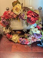 Front view of complete wreath showing full floral arrangement and color palette