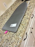 Top view of ironing board showing gray cover