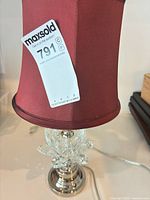 Full view of lamp showing burgundy shade, crystal accent, chrome base