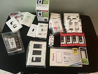 Entire lot showing switches, dimmer, outlet and wall plates