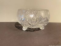 Side view of crystal bowl showing cut pattern and feet