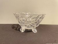 Side profile of crystal bowl displaying pattern and feet